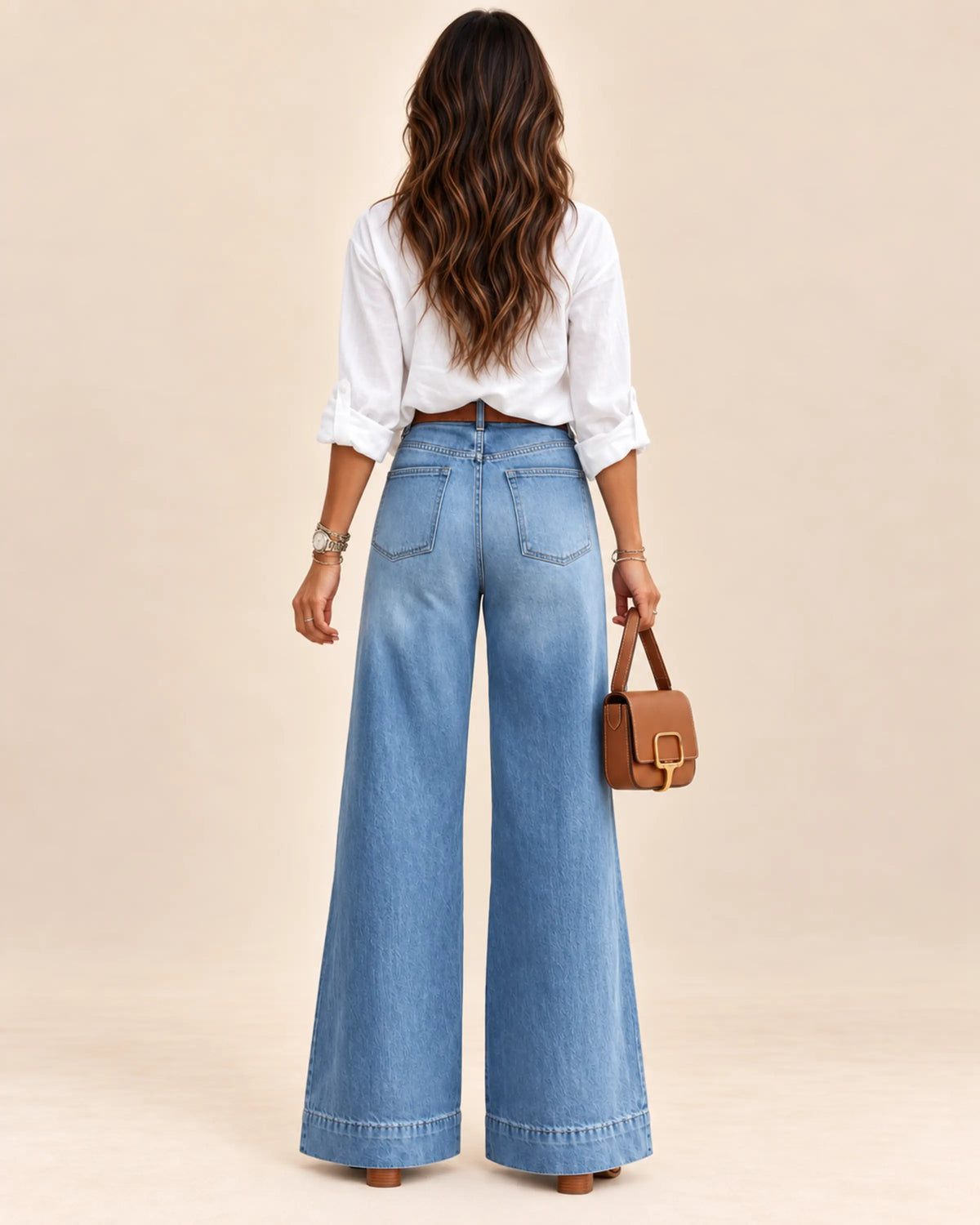 Solène washed blue high-rise wide-leg jeans on Sevda, back view on ivory background