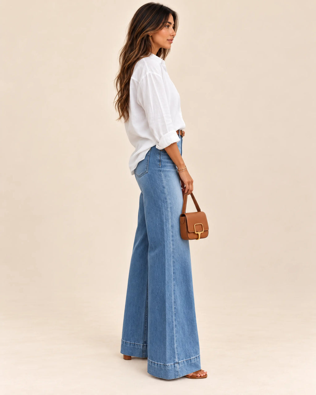 Solène washed blue high-rise wide-leg jeans on Sevda, right side view on ivory background